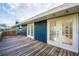 Exterior view of the property featuring a wood deck and french doors at 38934 Sulen Rd, Lady Lake, FL 32159