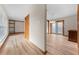 A spacious open living area featuring light wood floors and decorative wood beams and trim at 38934 Sulen Rd, Lady Lake, FL 32159