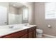 Bathroom featuring double sink vanity with a toilet and a shower at 4053 Brookshire Cir, Eustis, FL 32736