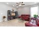 Comfortable living room featuring tile flooring, a ceiling fan, and stylish decor at 4053 Brookshire Cir, Eustis, FL 32736