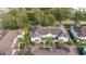 Aerial view showcases the townhomes' layout and proximity to a treed park and road at 5354 Diplomat Ct # 106, Kissimmee, FL 34746