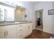 Bright bathroom features double granite vanity and a separate shower/tub area and wood look flooring at 5354 Diplomat Ct # 106, Kissimmee, FL 34746