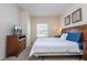 Cozy bedroom with a large window for natural light and wooden furniture at 5354 Diplomat Ct # 106, Kissimmee, FL 34746