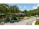 Exterior of a blue clubhouse in a community with beautiful landscaping and well-kept grounds at 5354 Diplomat Ct # 106, Kissimmee, FL 34746