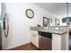 Granite counter tops and stainless steel appliances highlight this charming kitchen at 5354 Diplomat Ct # 106, Kissimmee, FL 34746