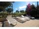 Relaxing outdoor lounge area with comfortable seating under lush greenery, offering a peaceful retreat at 5354 Diplomat Ct # 106, Kissimmee, FL 34746