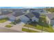 A single-story house featuring a well-manicured lawn, gray exterior paint, and attached garage at 5430 Pine Lilly Dr, St Cloud, FL 34771