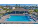 Overhead view of the community pool with lots of chairs for residents to use at 5430 Pine Lilly Dr, St Cloud, FL 34771