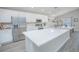 Bright, modern kitchen with stainless steel appliances, large island, and plenty of counter space at 5430 Pine Lilly Dr, St Cloud, FL 34771