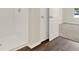 Shower and bathroom area with white tile and a glimpse into the bedroom at 5844 Galloping Dr, Apopka, FL 32712
