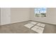 Neutral bedroom with a large window, carpet flooring, and ample natural light at 5844 Galloping Dr, Apopka, FL 32712