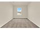 Empty bedroom features carpet, neutral walls, a window, and ample space at 5844 Galloping Dr, Apopka, FL 32712