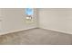 Bedroom featuring a window, neutral walls, and carpet flooring at 5844 Galloping Dr, Apopka, FL 32712