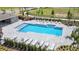 Aerial view of a community pool surrounded by lounge chairs and landscaped areas at 5844 Galloping Dr, Apopka, FL 32712