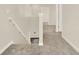 Carpeted staircase with white trim and railing leading to upper or lower levels at 5844 Galloping Dr, Apopka, FL 32712