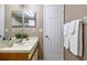 Cozy bathroom with vanity, sink, white cabinets, and a mirror at 615 Richland Ct # 61, Altamonte Springs, FL 32714