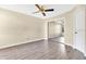 Bedroom with hardwood floors, ceiling fan, closet, and neutral paint at 615 Richland Ct # 61, Altamonte Springs, FL 32714