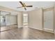 Bright bedroom with hardwood floors, a ceiling fan, and a closet with sliding doors at 615 Richland Ct # 61, Altamonte Springs, FL 32714