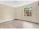Cozy bedroom with hardwood floors, a window, and neutral paint at 615 Richland Ct # 61, Altamonte Springs, FL 32714