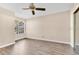 Neutral bedroom with hardwood floors, ceiling fan, and a window for natural light at 615 Richland Ct # 61, Altamonte Springs, FL 32714