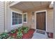 Inviting front door with a cozy front porch and a welcoming landscaped yard at 615 Richland Ct # 61, Altamonte Springs, FL 32714