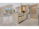 Bright kitchen features tile floors, light wood cabinets, and an open floor plan at 615 Richland Ct # 61, Altamonte Springs, FL 32714