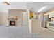 Neutral toned living room with open floor plan, and a cozy brick fireplace at 615 Richland Ct # 61, Altamonte Springs, FL 32714