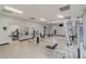 Well-equipped gym with treadmills, weight machines, and mirrors for a complete fitness experience at 6166 Westgate Dr # 302, Orlando, FL 32835