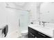Bright bathroom featuring a shower with glass enclosure, toilet, vanity with a sink, and neutral walls at 720 N Pennsylvania Ave, Winter Park, FL 32789
