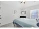 This bedroom has a comfortable bed, neutral walls, and a ceiling fan, creating a relaxing retreat at 720 N Pennsylvania Ave, Winter Park, FL 32789