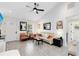 Bright living room with wood-look tile flooring, neutral sofa, pops of color, and contemporary decor at 720 N Pennsylvania Ave, Winter Park, FL 32789