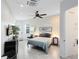 Tranquil main bedroom featuring modern furnishings, a ceiling fan, wood-look tile flooring, and ample lighting at 720 N Pennsylvania Ave, Winter Park, FL 32789