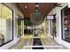 Indoor shopping mall with boutiques, restaurants, and a unique water feature at 720 N Pennsylvania Ave, Winter Park, FL 32789