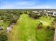Beautiful aerial view of the golf course surrounded by mature trees and lush landscaping, in the neighborhood at 726 N Pennsylvania Ave, Winter Park, FL 32789