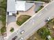 Aerial view of a well-maintained property with a brick driveway, lush greenery, and convenient street access at 726 N Pennsylvania Ave, Winter Park, FL 32789