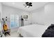 Bright bedroom with a white bed, shuttered windows and ample closet space for storage at 726 N Pennsylvania Ave, Winter Park, FL 32789