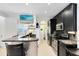 Contemporary kitchen with stainless steel appliances, sleek black cabinetry and tiled flooring at 726 N Pennsylvania Ave, Winter Park, FL 32789