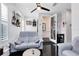 Inviting living room with a blue sofa, dark wood floors, and stylish decor at 726 N Pennsylvania Ave, Winter Park, FL 32789