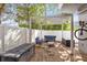 Stylish brick patio featuring a white pergola, comfortable seating, and convenient storage, perfect for outdoor entertaining at 726 N Pennsylvania Ave, Winter Park, FL 32789