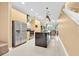 Well-appointed kitchen featuring a stainless steel appliances and an open layout at 7663 Recife Dr, Kissimmee, FL 34747