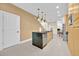 The kitchen has an island, lots of lighting, and stainless steel appliances at 7663 Recife Dr, Kissimmee, FL 34747