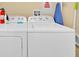 A spacious and well-organized laundry room with modern appliances at 7663 Recife Dr, Kissimmee, FL 34747