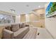 Upstairs living area with stylish lighting fixture and comfortable seating arrangement at 7663 Recife Dr, Kissimmee, FL 34747