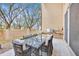 Outdoor patio with stone wall, a grill and dining area, perfect for outdoor entertaining at 7663 Recife Dr, Kissimmee, FL 34747