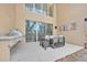 Outdoor patio with a built-in grill and seating area for dining and relaxing at 7663 Recife Dr, Kissimmee, FL 34747
