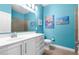 Charming bathroom features a white vanity with drawers and a fully tiled walk-in shower at 8807 Tatara St, Orlando, FL 32836