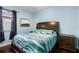 Comfortable bedroom with wood floors and a beautiful bed at 8807 Tatara St, Orlando, FL 32836