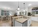 Open floorplan showing kitchen, dining and living room areas with complementing décor at 8807 Tatara St, Orlando, FL 32836