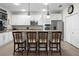Bright kitchen with white cabinetry, granite countertops, and stainless steel appliances at 8807 Tatara St, Orlando, FL 32836