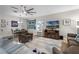 Living room with a ceiling fan, lots of seating, and space for dining at 8807 Tatara St, Orlando, FL 32836
